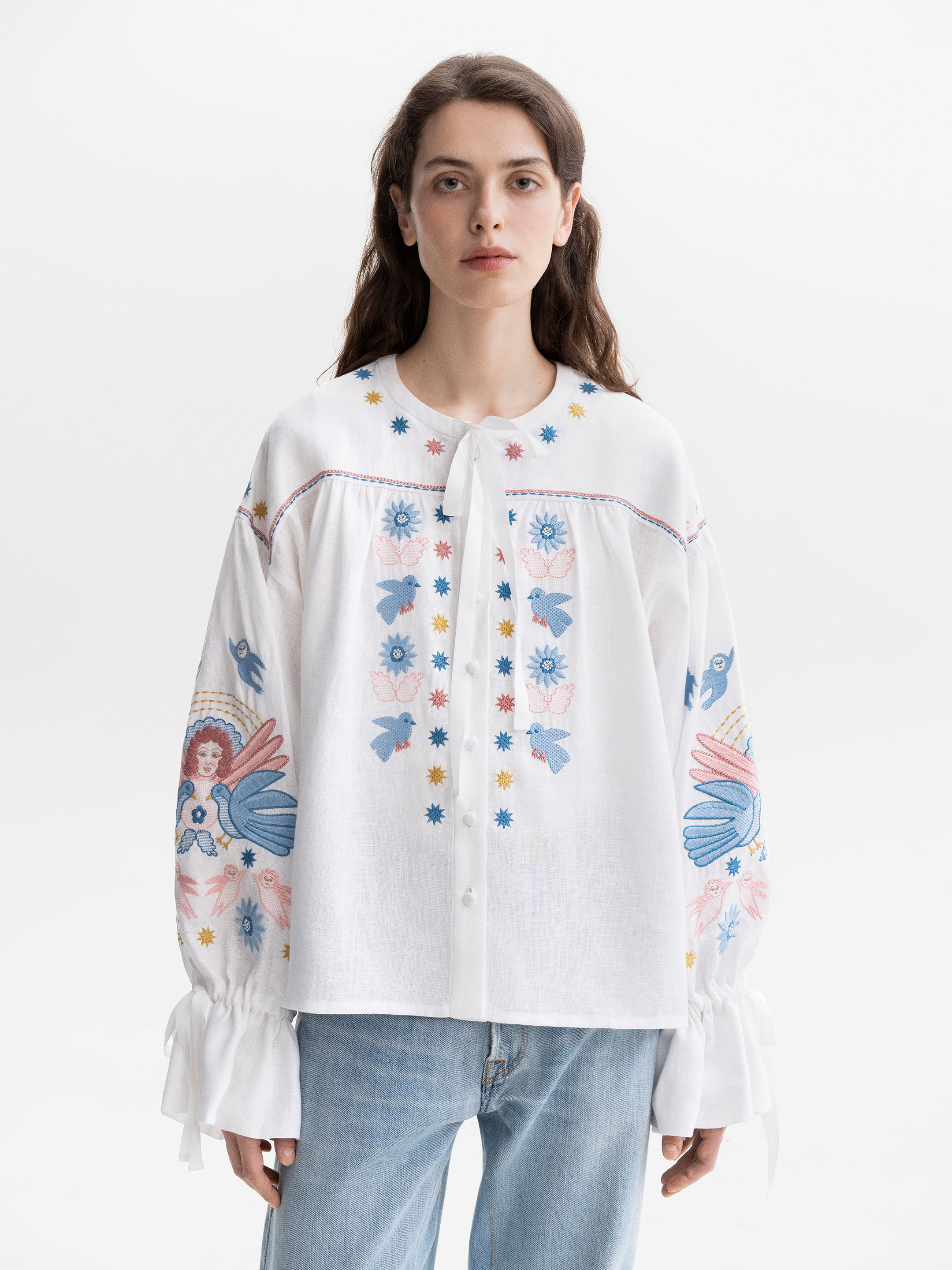 White embroidered shirt with abundant embroidery Prychornomorya photo