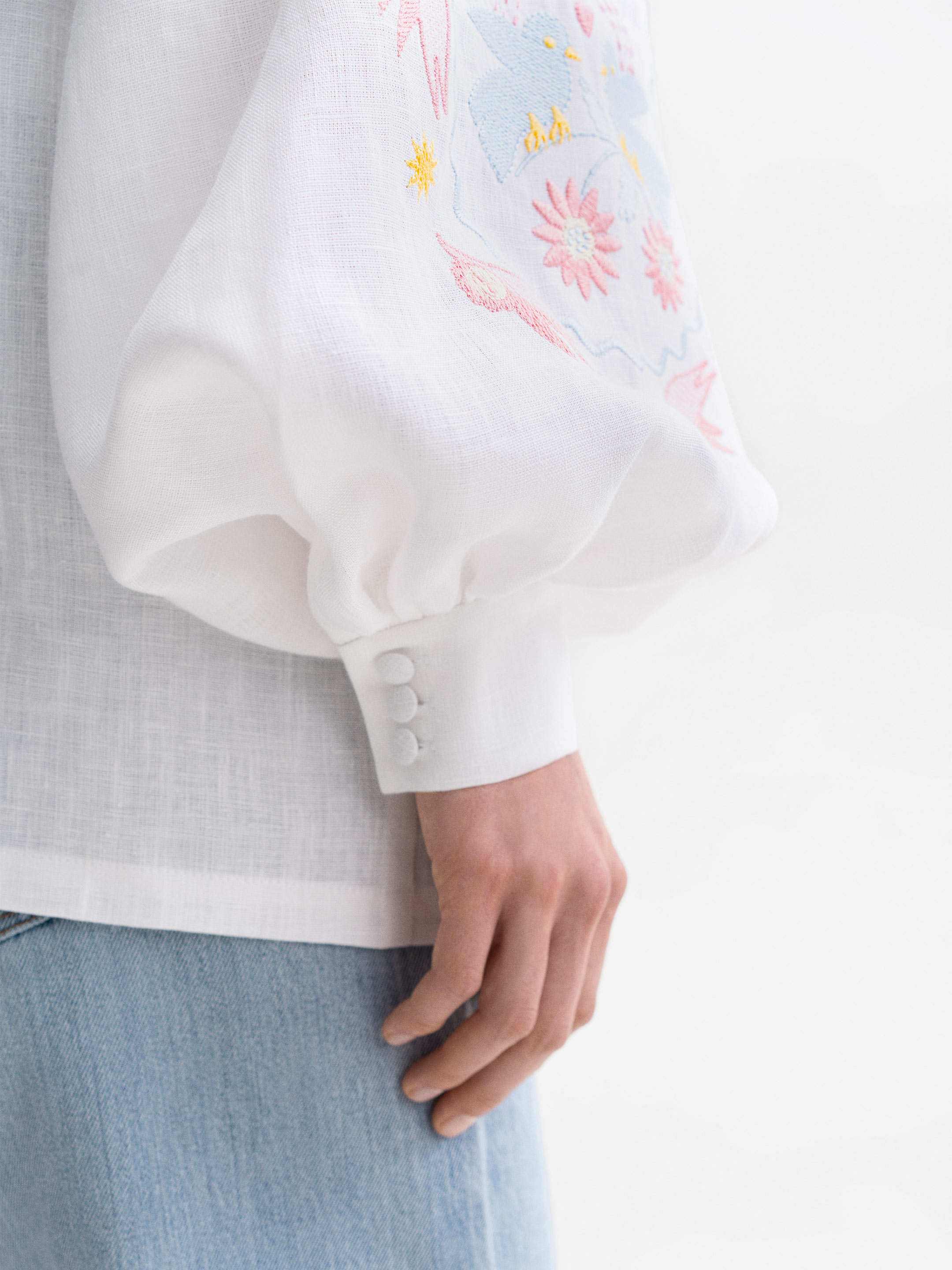 White embroidered shirt with colorful embroidery Polina fitting
